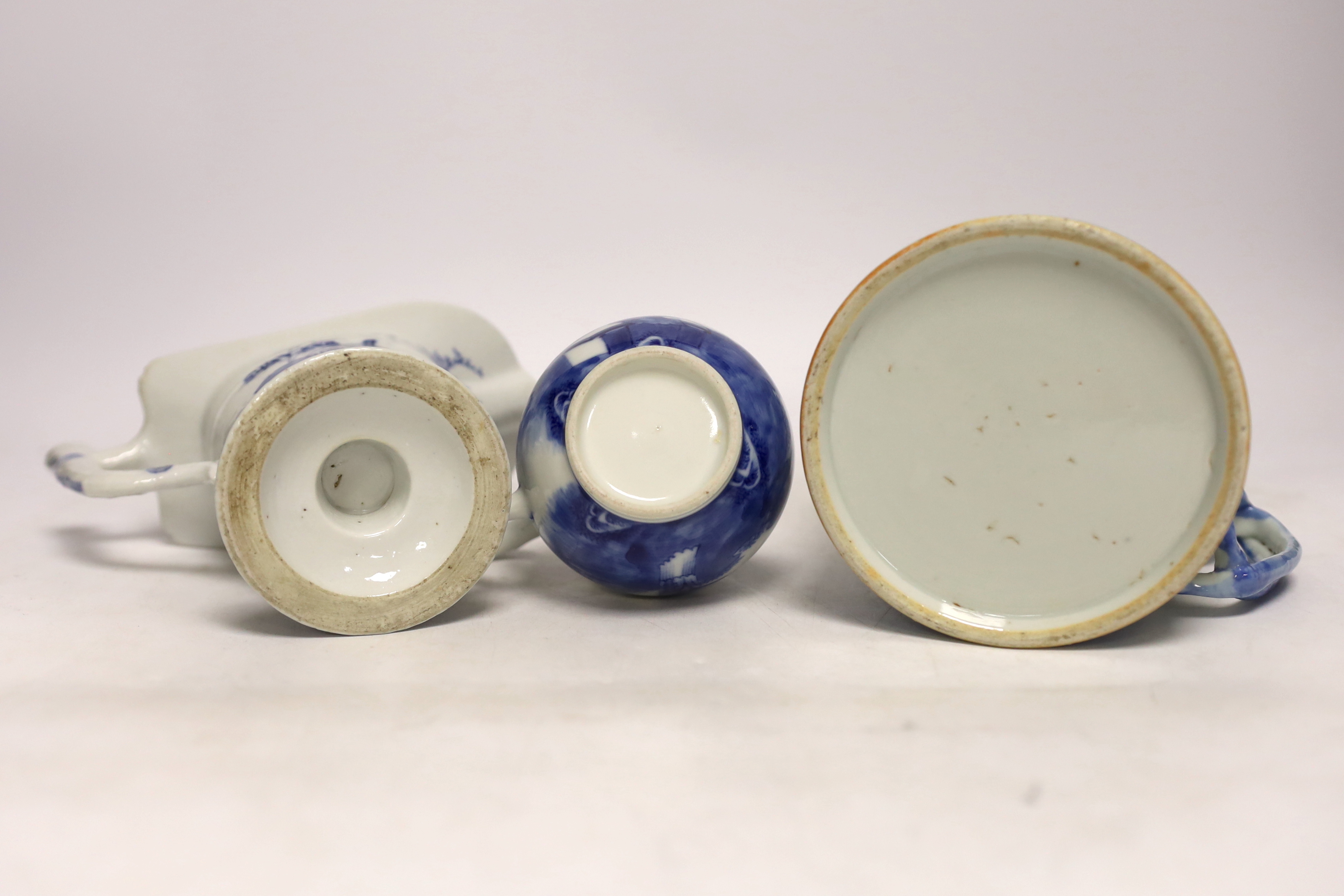 A Chinese blue and white mug and two jugs, 18th/19th century, largest 14cm high (3)